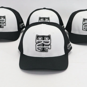 Four black and white caps with a logo on a light gray background