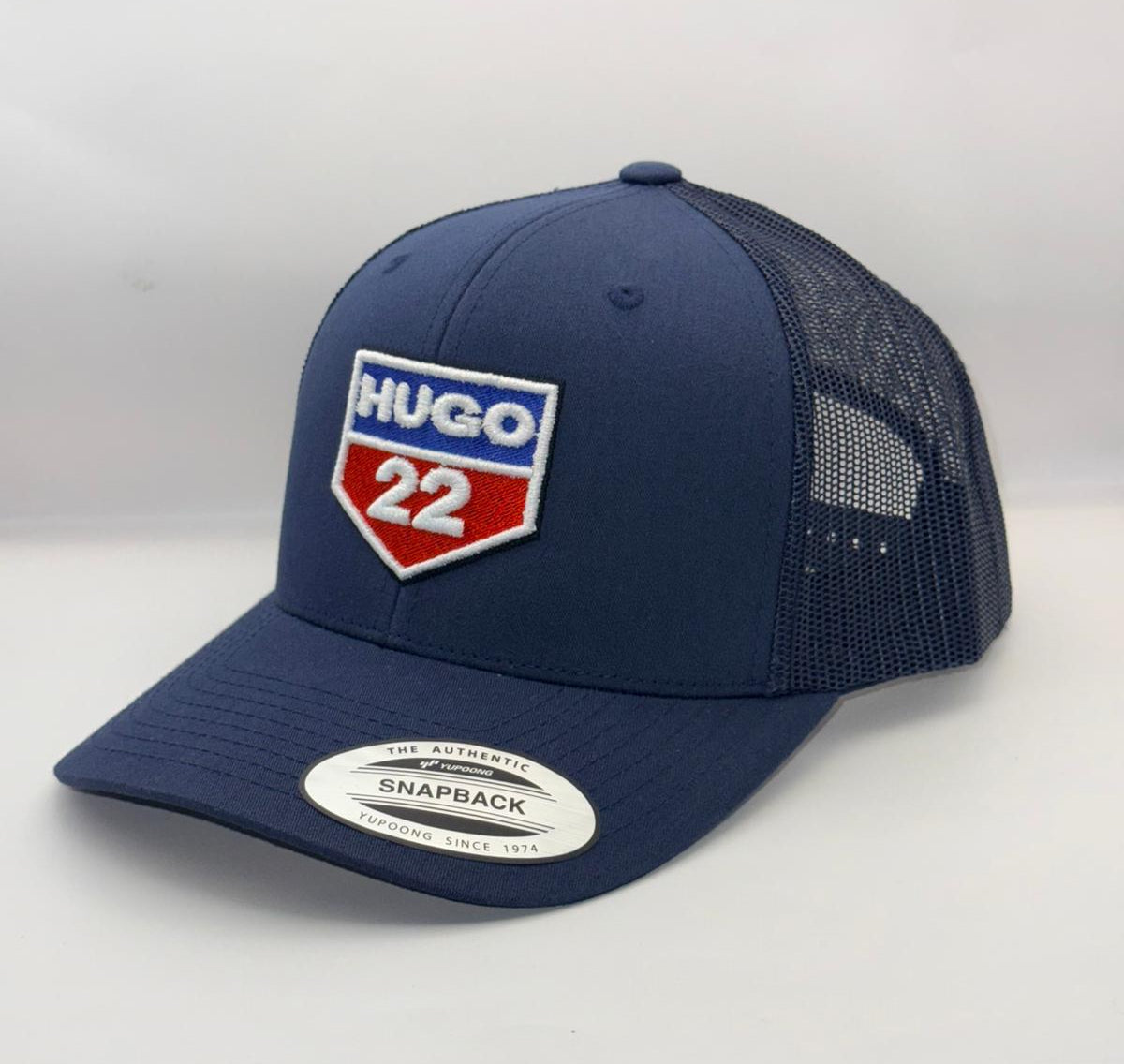 Navy blue cap with a logo and text on a white background