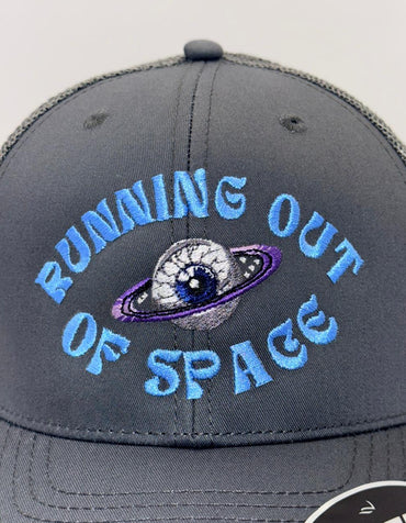 Gray cap with 'Running Out of Space' text and space-themed design on a white background