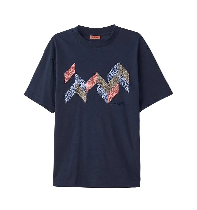 Navy blue t-shirt with colorful zigzag pattern on a light gray background