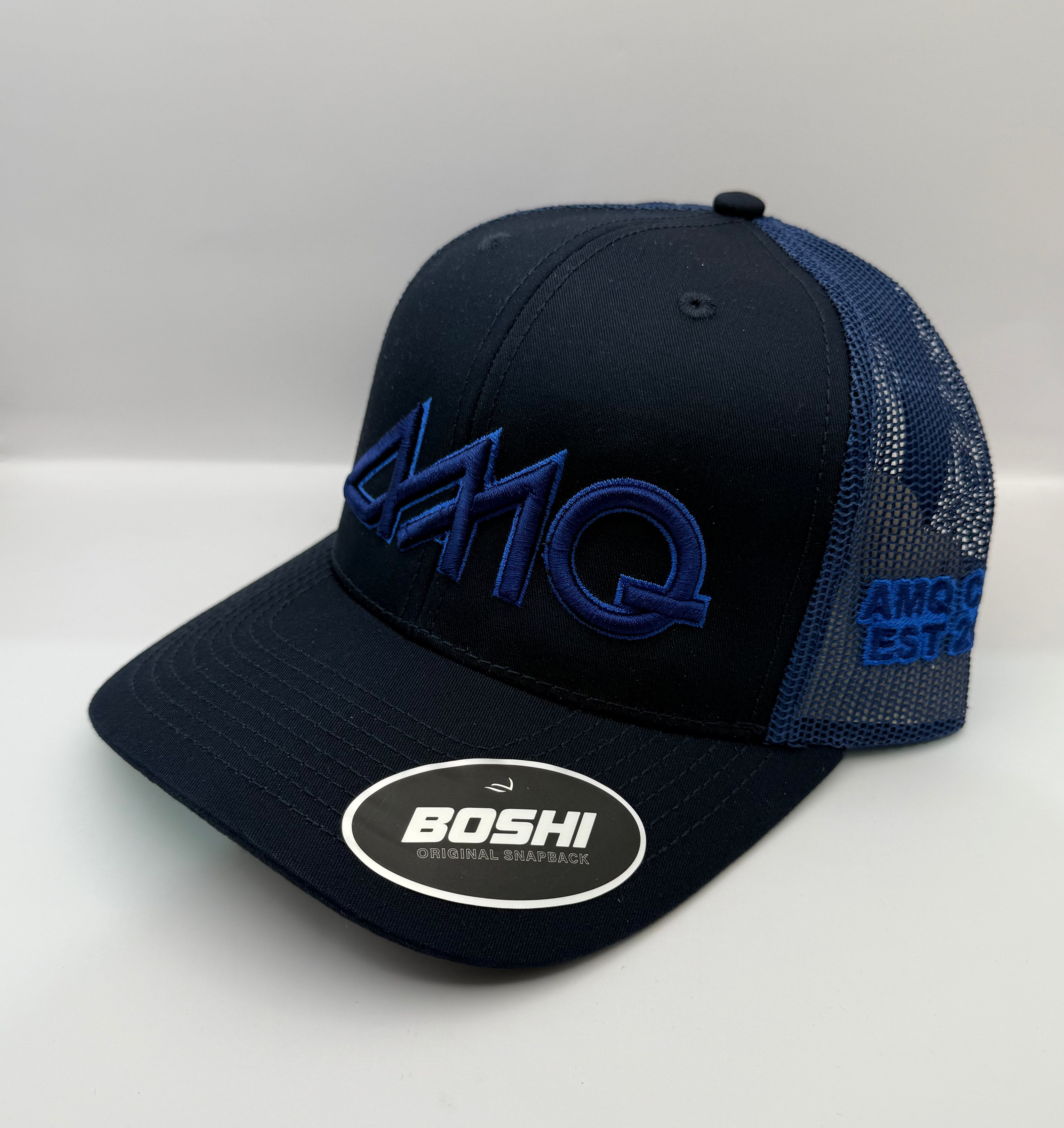 Black and blue cap with 'Boshi' branding on a white background