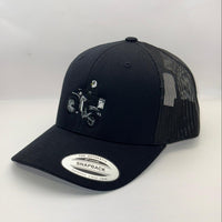 Black trucker cap with embroidered design on a white background