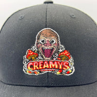Gray cap with a colorful 'Creamy's' logo on a white background