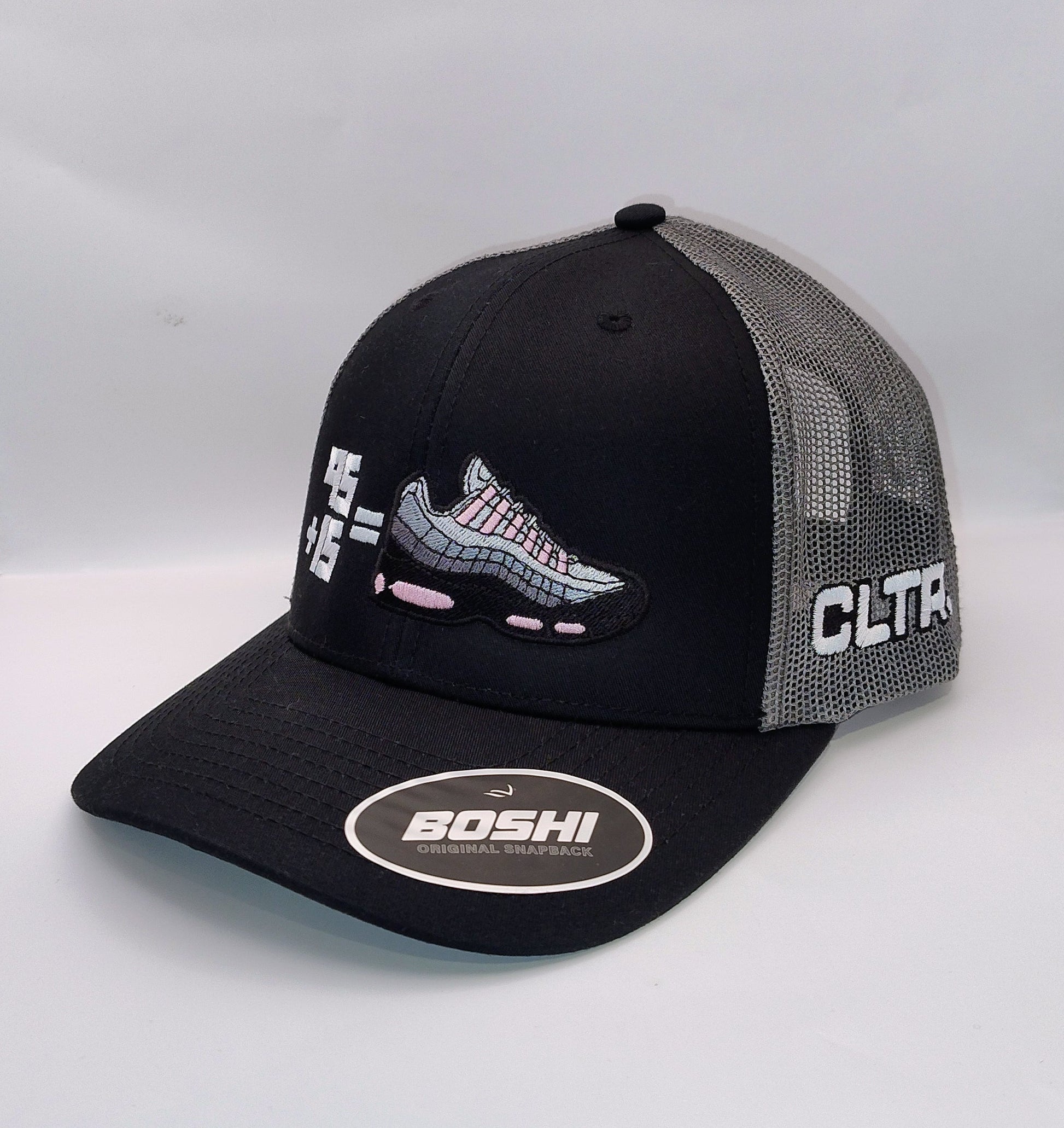 Black and gray cap with multiple brand logos on a white background