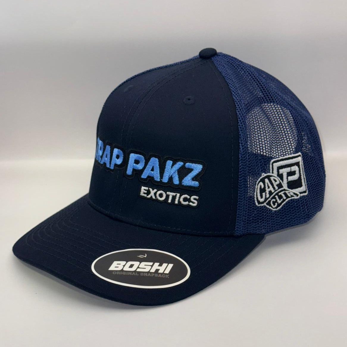 Navy blue cap with branding on a white background