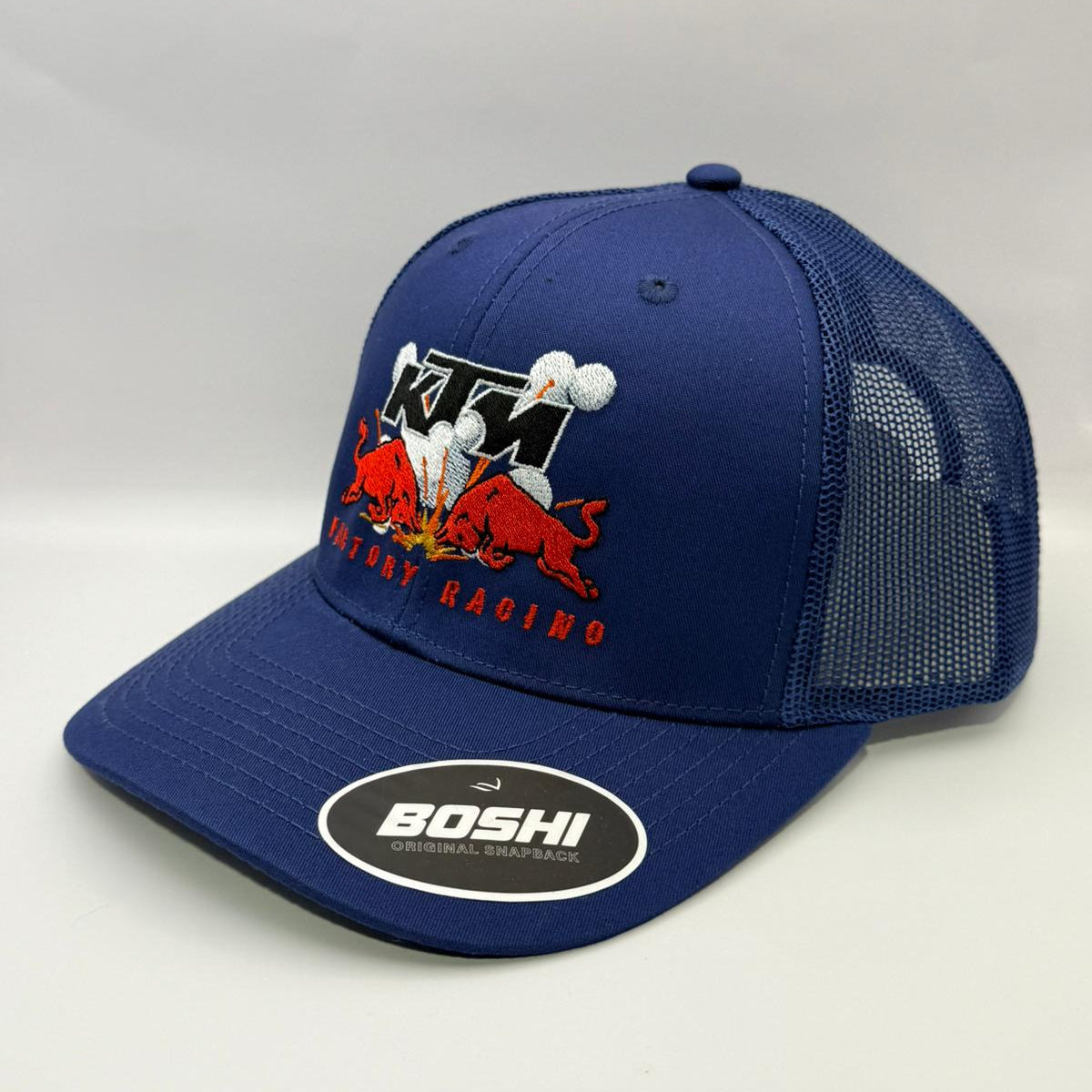 Blue cap with KTM logo and 'Boshi' branding on a white background