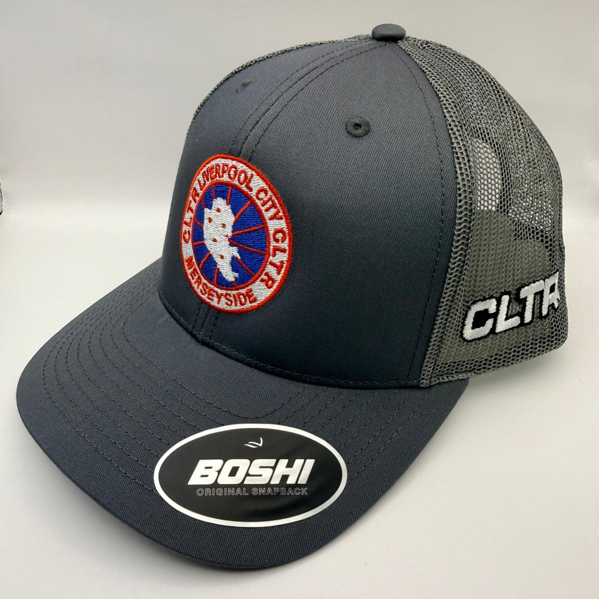 Gray cap with embroidered logos on a white background