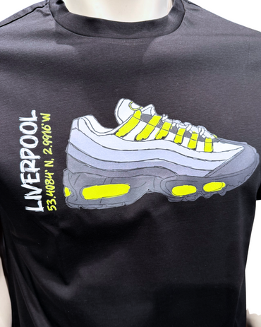 Black t-shirt with a graphic of a white sneaker with yellow accents and text on a white background