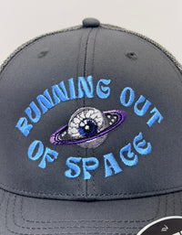Gray cap with 'Running Out of Space' text and space-themed design on a white background