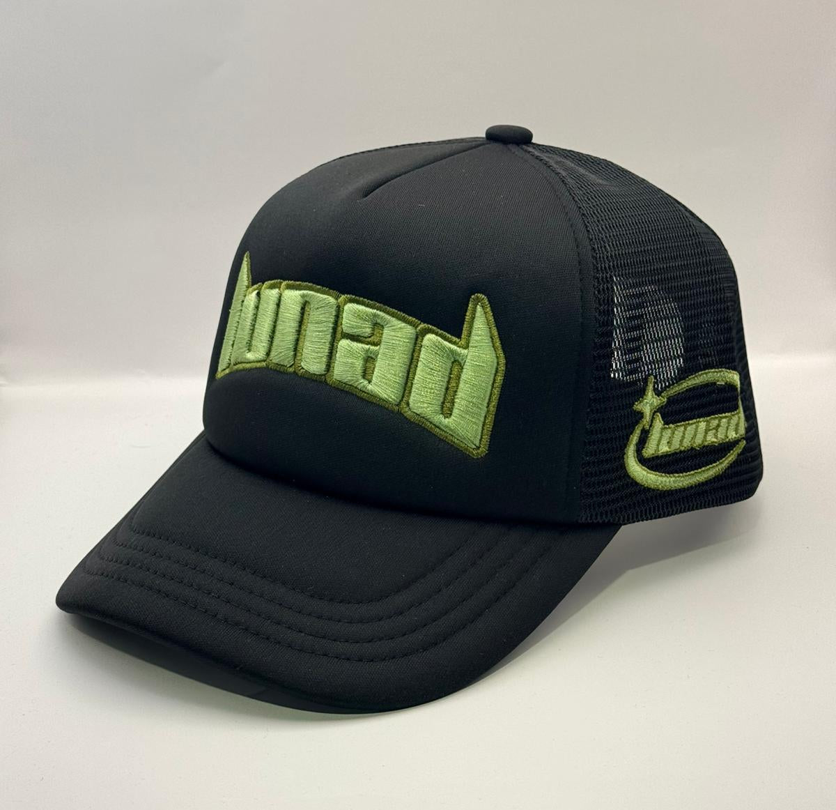 Black cap with green text on a white background
