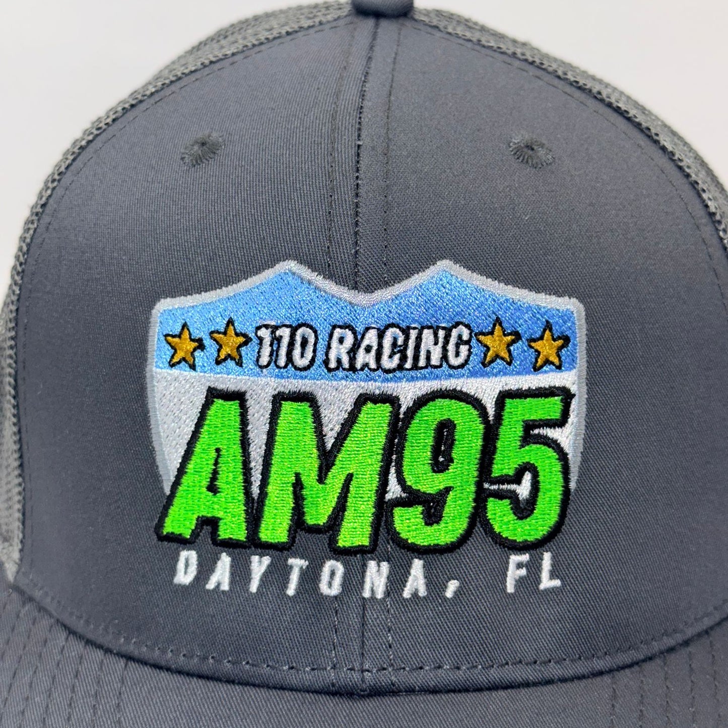 Gray cap with '110 Racing AM95 Daytona, FL' logo on a white background
