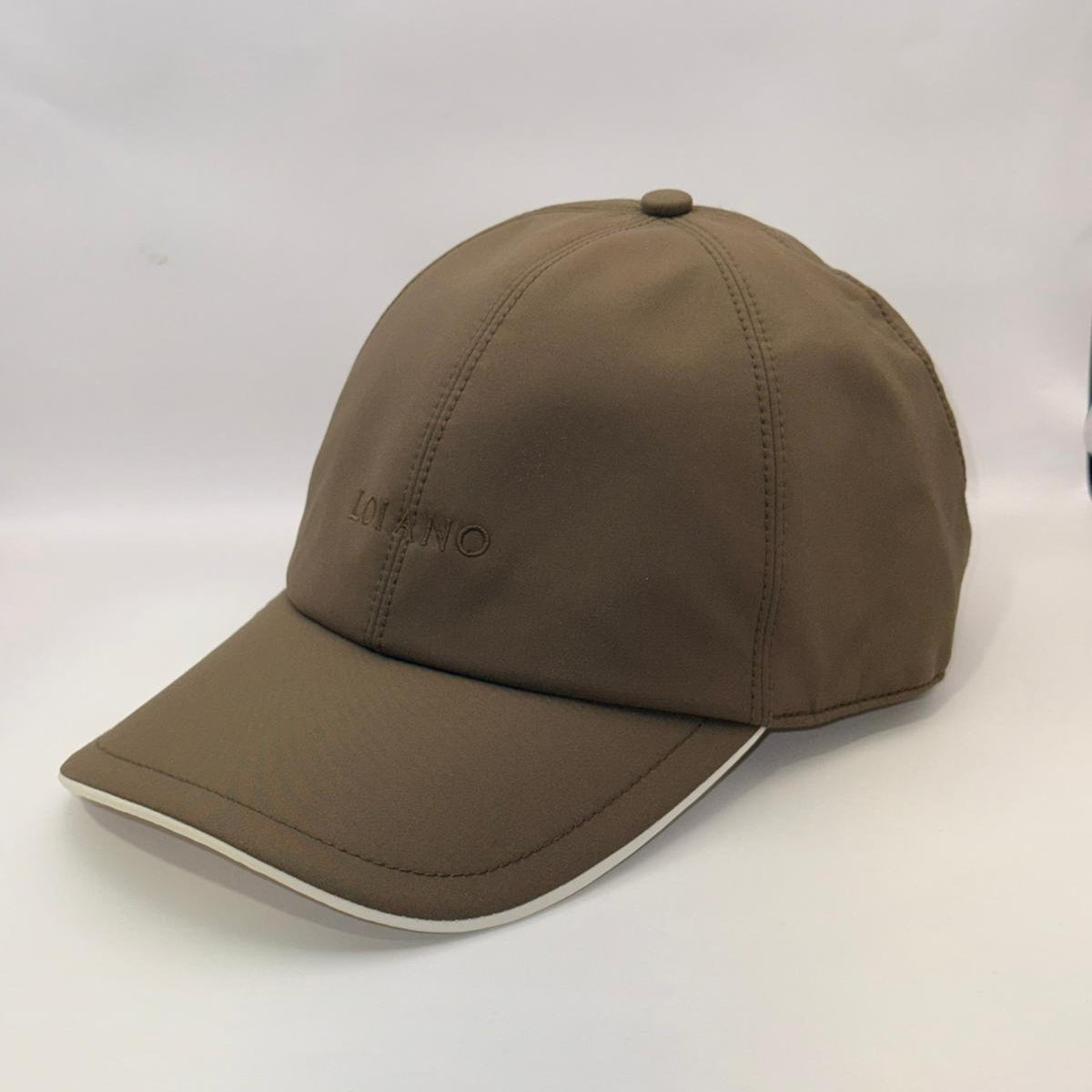 Brown cap on a white surface with a blurred background