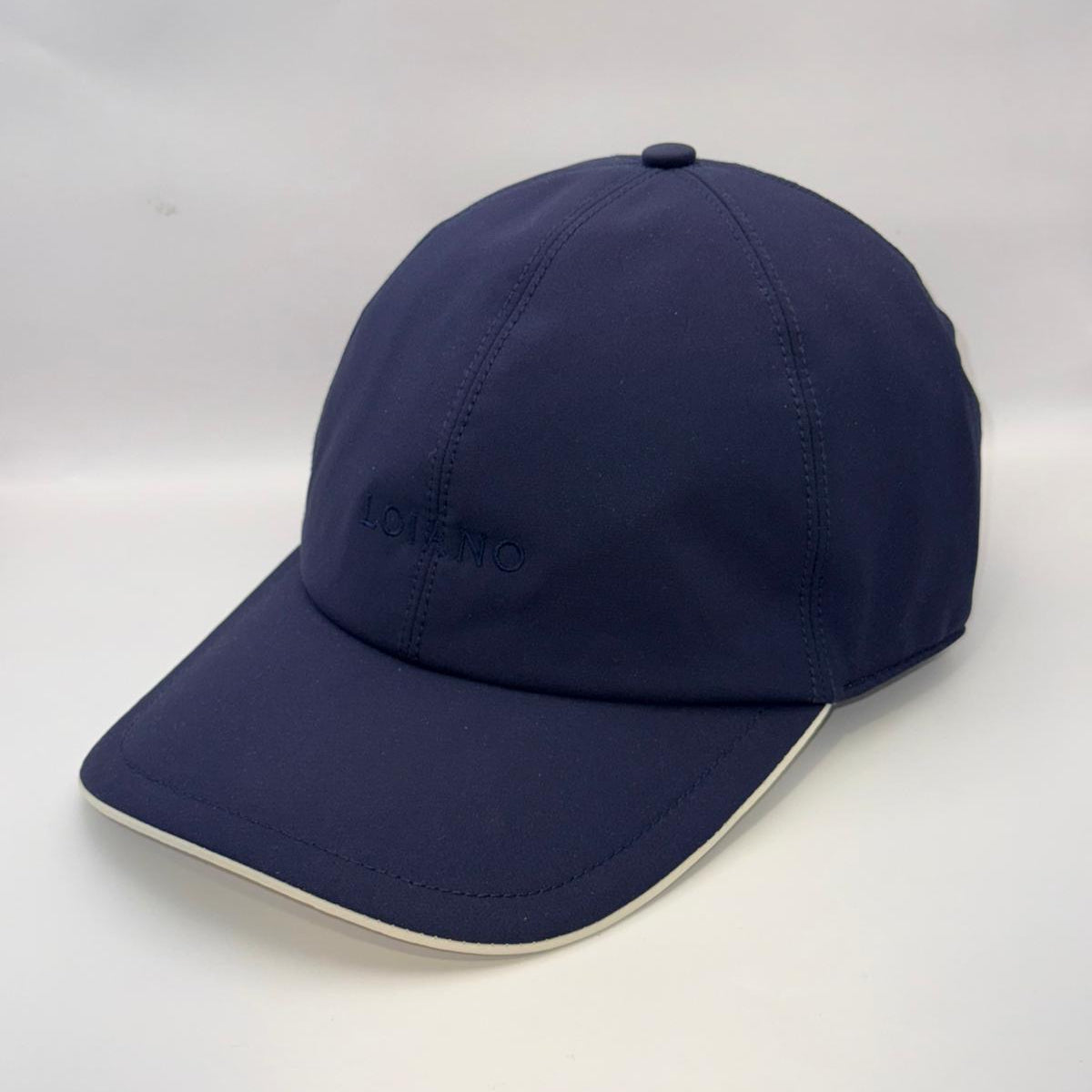 Navy blue cap with a brand logo on a white background