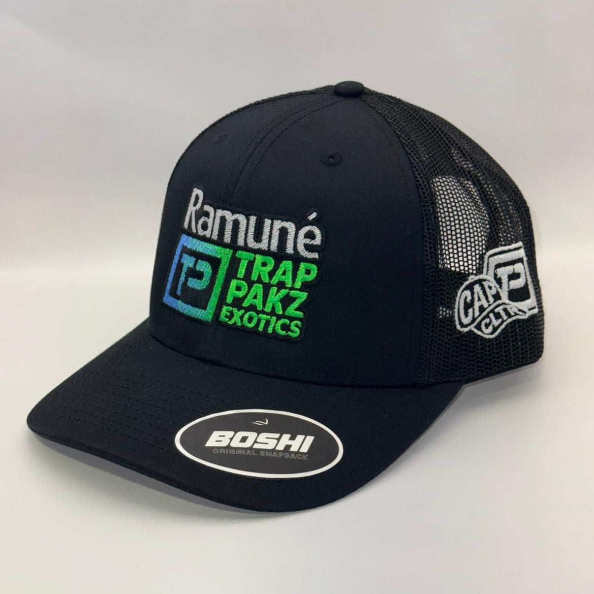 Black cap with multiple brand logos on a white background