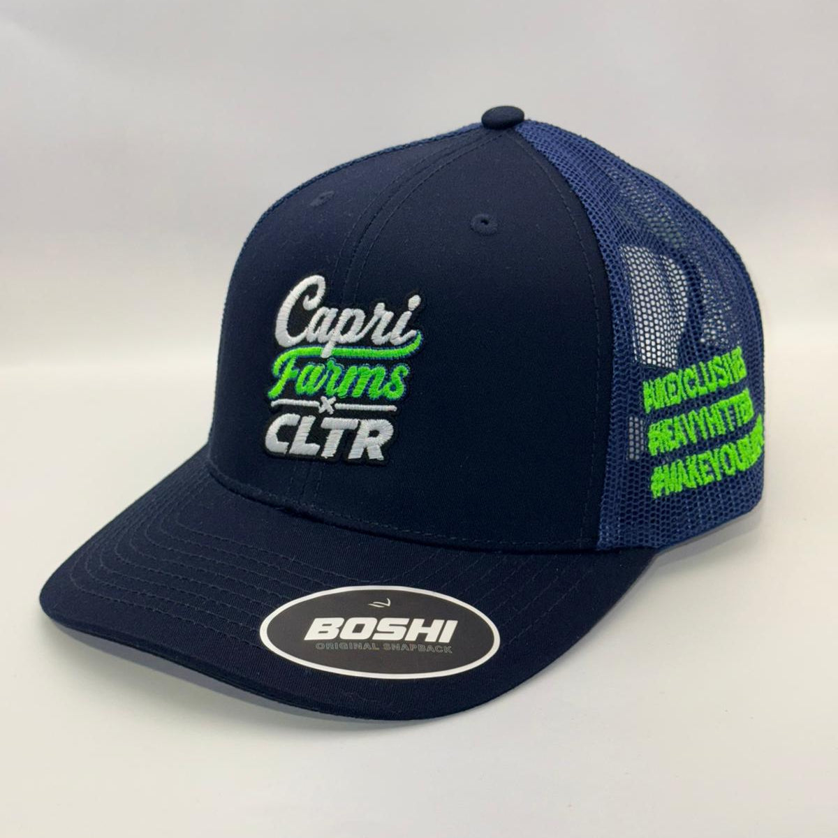 Navy blue cap with branding on a white background