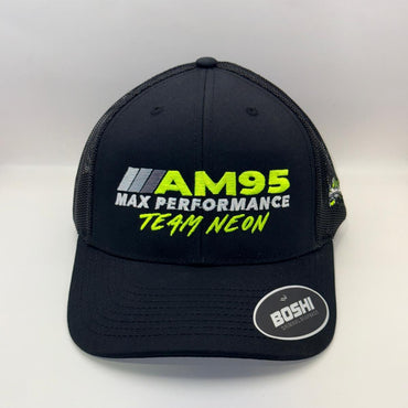 A black trucker-style cap with mesh back panels, featuring 'AM95 MAX PERFORMANCE TEAM NEON' embroidered on the front in neon green and white, with a circular 'BOSHI' sticker on the brim.