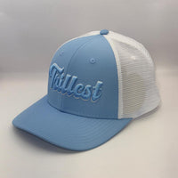 A light blue and white trucker-style baseball cap with 'Tillest' embroidered in light blue script on the front panel, set against a neutral light gray background.