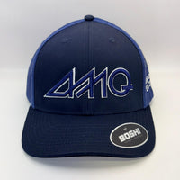 A navy blue trucker hat with a dark blue mesh back and a large stylized 'AMQ' logo embroidered on the front. The brand 'BOSHI' is visible on the sticker on the brim.