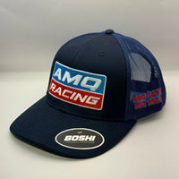 A navy blue and navy mesh trucker hat featuring a prominent 'AMQ RACING' embroidered patch on the front and a 'BOSHI' sticker on the visor, set against a plain light gray background.