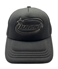 Black trucker cap with logo on a beige background