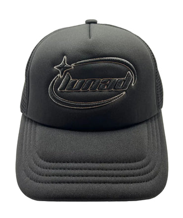 Black trucker cap with logo on a beige background